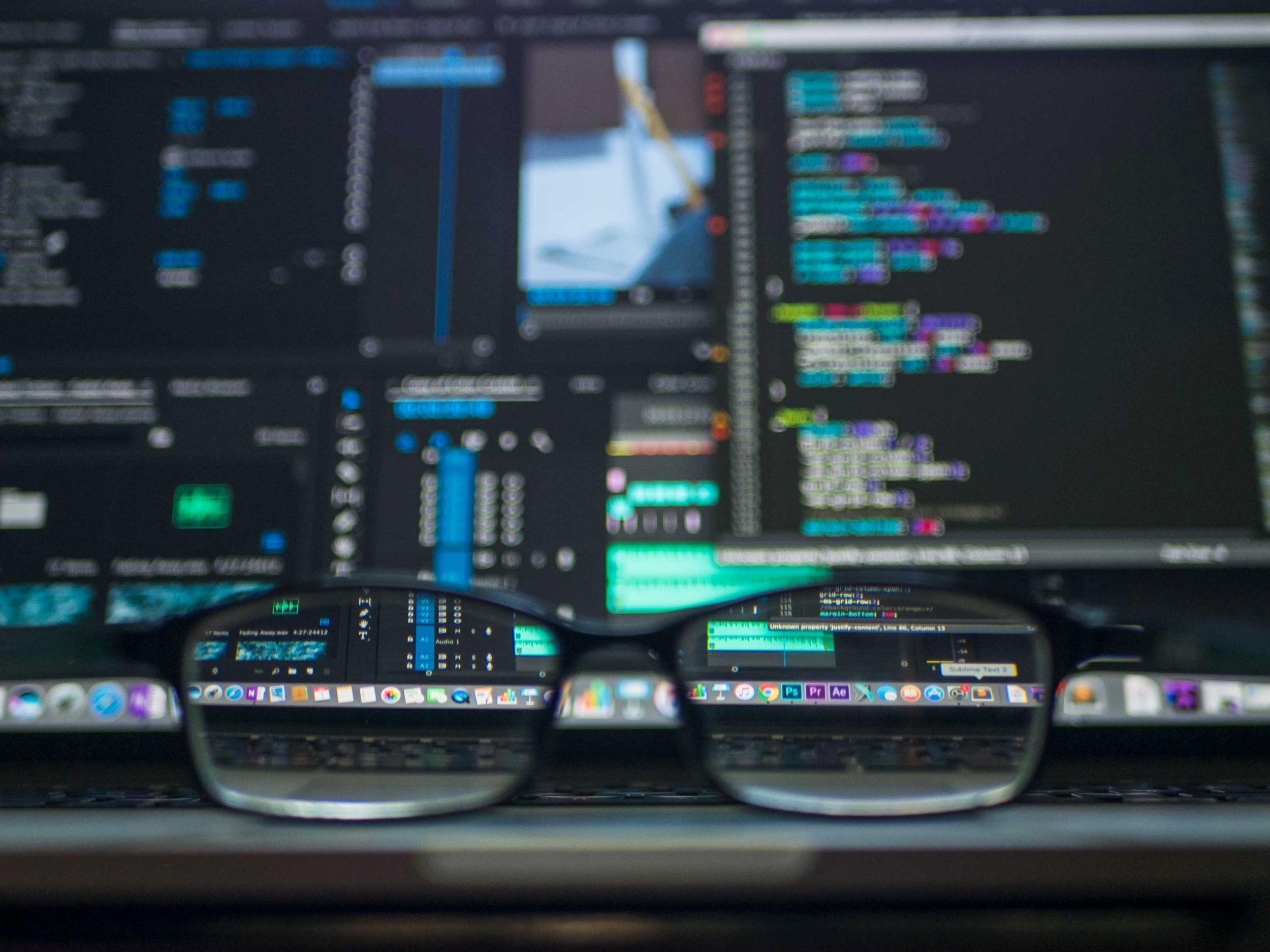 pexels-kevin-ku-577585 glasses laying in front of a computer monitor