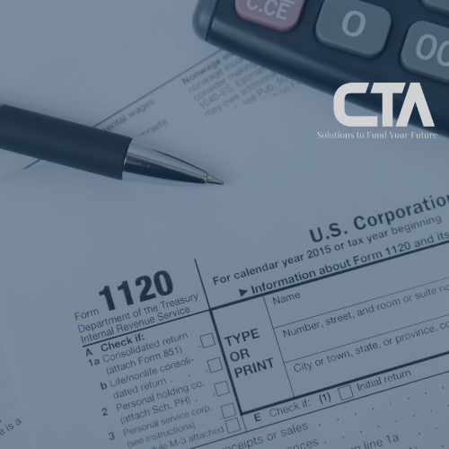 Copy of Blog photo pen on top of 1120 tax forms